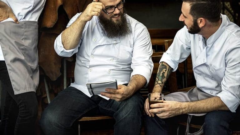 Two chefs sharing a chat